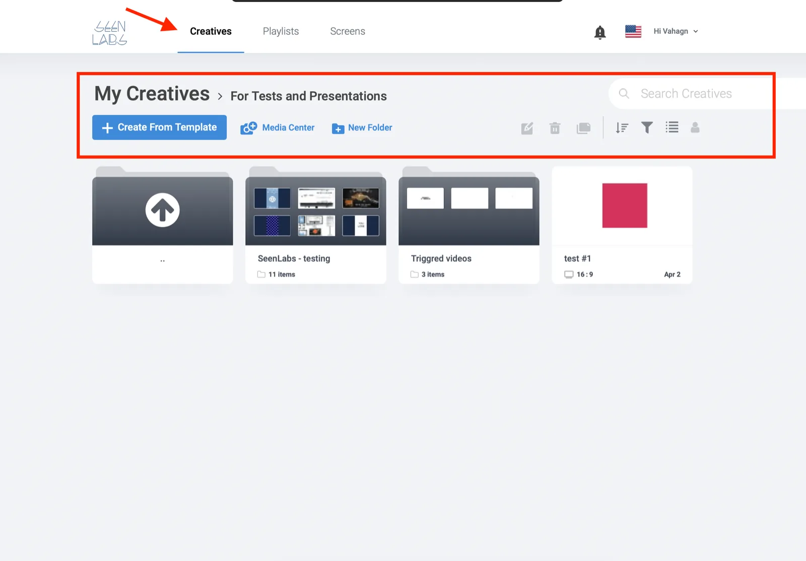The Creatives tab of the dashboard. An arrow points at Creatives in the top bar. Below it a highlighted toolbar holds the blue Create From Template button, Media Center, New Folder, and icons for edit, delete, copy, sort, filter and view. Underneath sit folders named SeenLabs - testing and Triggred videos and a creative called test #1.