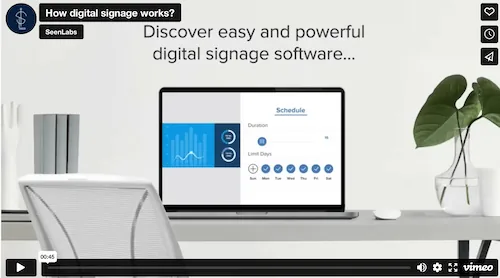 Video still: a laptop on a desk showing a scheduling panel with duration and day-of-week controls, under the headline "Discover easy and powerful digital signage software".